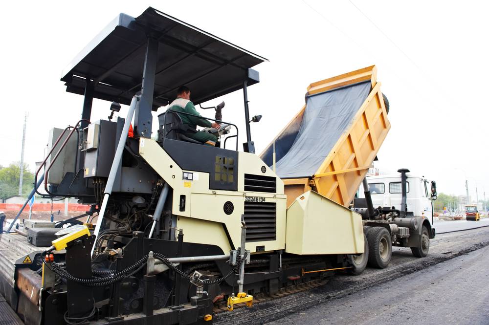 Tracked paver at asphalt pavement works for road repairing